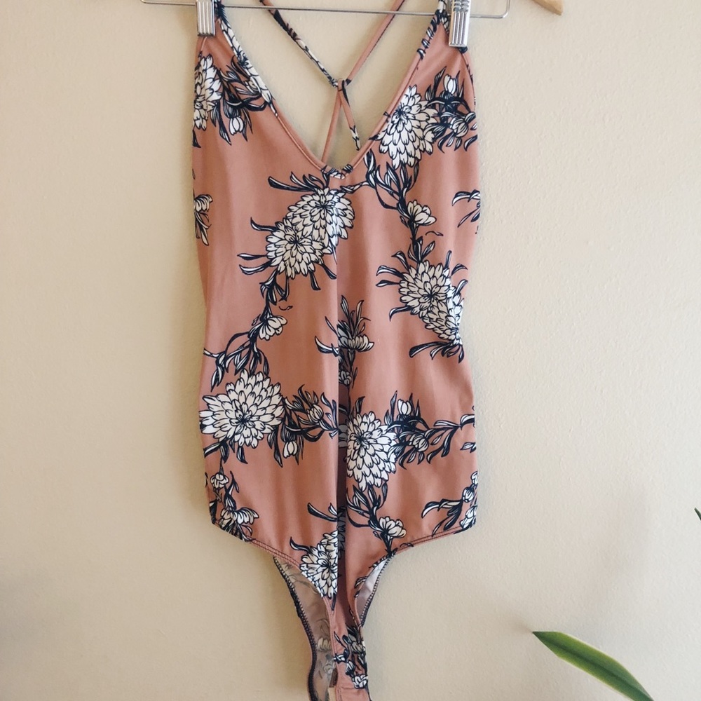 Pastel pink floral body suit t-back size: M